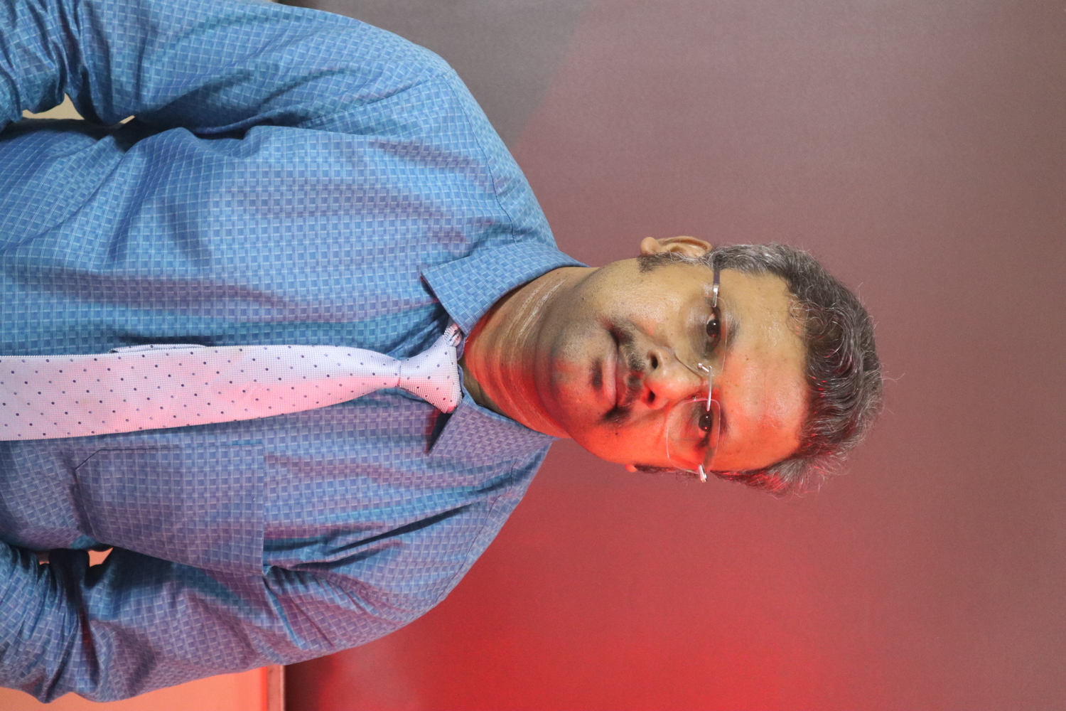 Physiotherapist assisting patient on a ball